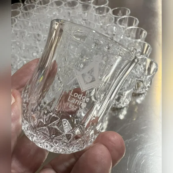 Crystal shot glass with engraved logo made with a 5W UV laser
